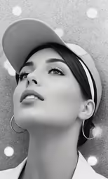 a woman wearing a hat with polka dot around it