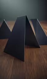 a table topped with black stacked blocks
