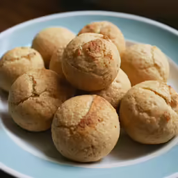 there are twelve muffins that have been placed on the plate