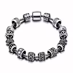 bracelet that features silver beaded beads,a 925 silver bracelet with celtic and floral charms