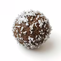 a chocolate and white sprinkled ball on a white surface