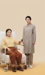 woman sitting in chair and boy standing in front