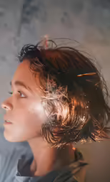 a person looking up at something in the sky