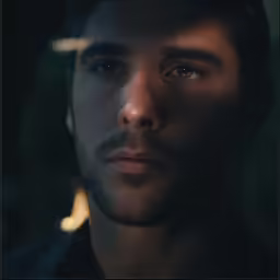 an older man staring at the camera