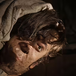 an old man that is covered up with clothing