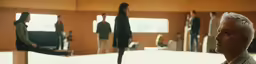 an older man is standing in front of some mirrors