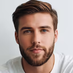 the young man has brown hair and blue eyes