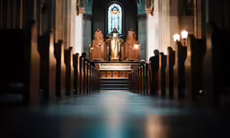 a church with benches, windows and light