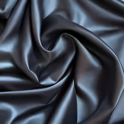 the top half of a grey fabric that is soft and shiny