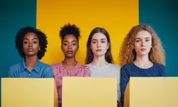 a group of women with square boxes standing in a row