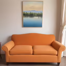 a small orange sofa against a white wall