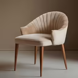 the beige chair is sitting against the wall