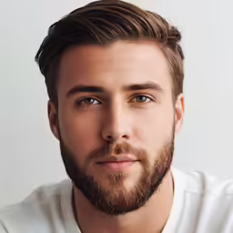 man with beard looking directly into the camera