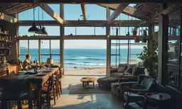 a dining table and chairs with a view from a beach house