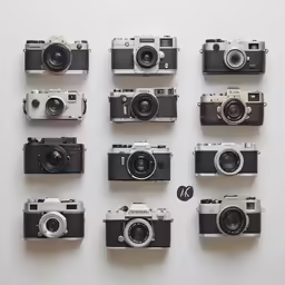 a selection of various antique cameras lined up