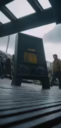 this is a radio sitting on the ground in front of a group of people