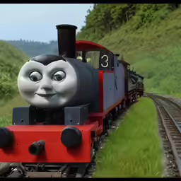 the thomas the tank train traveling on a track