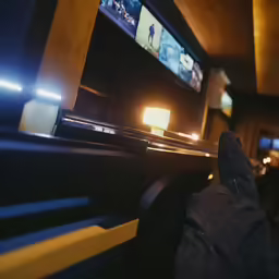 a person standing in front of a flat screen tv