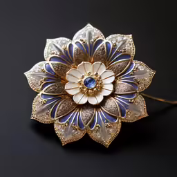 a blue and white flower shaped broochle