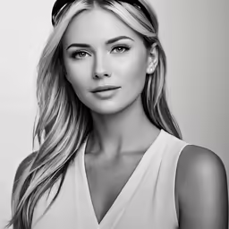 the blond woman is wearing a white shirt