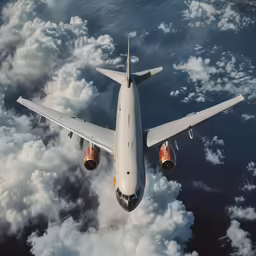 a jet in flight above the clouds and water
