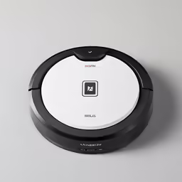 a roomba on a gray surface, with black trim