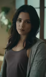 this is a woman with long dark hair in a sweater