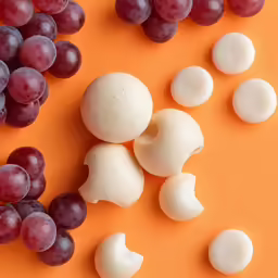 a close up of food on a orange surface