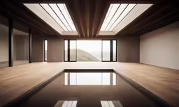 an empty room with mirrors and a ceiling