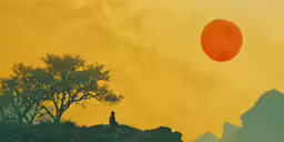 a silhouetted person standing on top of a mountain under a red balloon