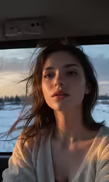 the woman is sitting in the backseat of a car