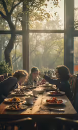 a group of women sitting at a table eating food