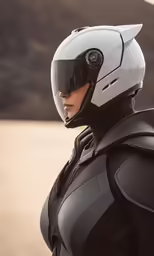 a woman wearing a black suit and helmet