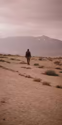 a man that is standing in the dirt