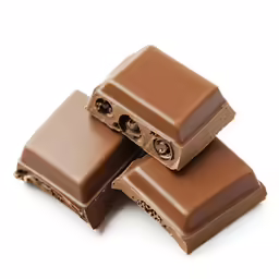 chocolate is topped with a few pieces cut out