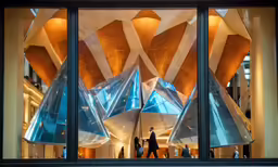 a window view of some art work on display in a building