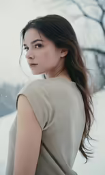 the woman has long hair and brown eyes
