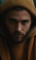 the young man is looking into the camera