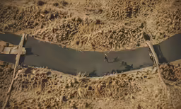 a dirt track with a motorcycle riding in it