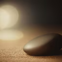 a close up view of a rock with light shining on it