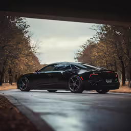 a black sports car parked on a city street
