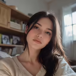 a close up of a woman laying on a bed