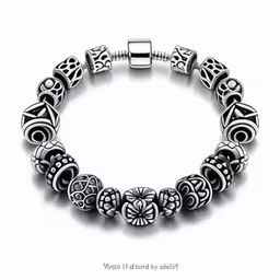 the bracelet is made from silver beads and has four hearts on each side,a silver bracelet with hearts and floral accents