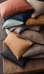 cushions stacked up on a stool