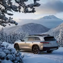 a large, off road car is parked in the snow