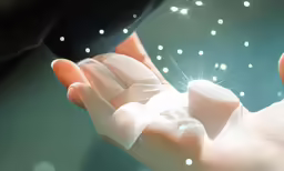 a close up of a baby hand holding something
