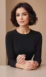 an attractive woman in black is posing for the camera