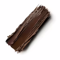 some chocolate that is cut in half and on the ground