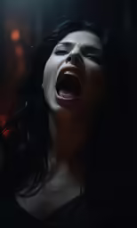 woman with open mouth in dark room of building