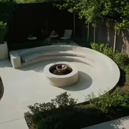 a circular patio with a fire pit in the middle